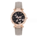 Detailed close-up of rose gold watch case with rhinestones and butterfly dial design - Gray