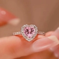 Elegant silver halo ring featuring a heart-shaped pink stone and clear pavé accents - Pink Diamond Heart Ljz-231 / Adjustable Open