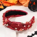Macro shot of Halloween headband with spider web pattern, pearls, and crystals - Knotted Spider Web Red Style With Pearls
