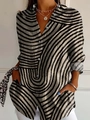 Detail of classic black and white striped shirt with button-down collar and long sleeves - S / Striped