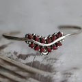 Bohemian silver cuff bracelet featuring two rows of red teardrop stones and vintage metalwork - 13 Teardrop Red Stone