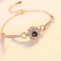 Rose gold projection bracelet with circular pendant and crystal inlay for a custom gift - Rose Gold