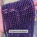 Handheld display of 7A natural amethyst beads strands with premium purple luster - 7a Natural Amethyst / 4mm approx 90pcs