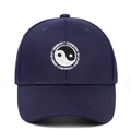 Close-up of Tai Chi Yin Yang embroidery and Swimming text on navy baseball cap - Adjustable / Navy Blue