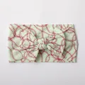Detail of soft pale green nylon baby headband with baseball stitch print and bow knot - Light Green Baseball Pattern