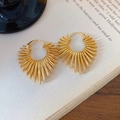 Elegant gold radial sunburst mesh hoop earrings on a vintage book background - Radiant Sunburst Round Style (金属风线条桃心耳扣)