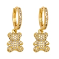 Fashionable gold bear drop earrings with micro-pave cubic zirconia and huggie style buckles - White