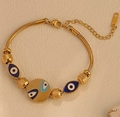 Close-up of golden Evil Eye snake chain bracelet with blue enamel charms and lobster clasp - S082 Gold Round Evil Eye Bracelet