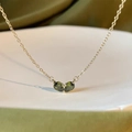 Elegant gold necklace featuring heart-shaped deep green gemstones with fine chain - Green Bud Heart Style