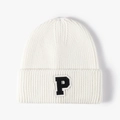 White ribbed knit beanie for women featuring a black and white varsity letter P patch - White