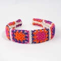 Handmade crochet floral headband with bohemian multicolored knit pattern in vibrant orange - Fuchsia Floral