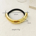 Minimalist black hair tie with premium polished gold metal arc tube and dimensions info - Gold