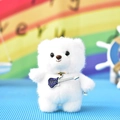 Close-up detail of a cute white plush bear keychain pendant holding a purple electric guitar - Ball Chain / White