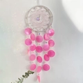 White dreamcatcher wind chime with pink shell tassels and rainbow light reflections - Pink