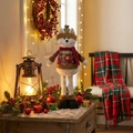Christmas cat plush with long legs, plaid hat and red scarf in festive indoor setting - Telescopic Cat (ML-Q777)