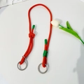 Oranje en groen gevlochten koord met metalen ringen en outdoor knoop voor forenzen - Universele Riem / Oranje Groen Gestippeld
