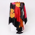 Detail of silk scarf with vibrant floral print on black background hanging on a cube - 90x90cm / Black (D9223)