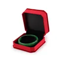 Octagonal red velvet jewelry box with an emerald green jade bangle bracelet inside - Bracelet Box / Red With Black Interior
