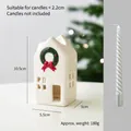 White ceramic house candle holder with green Christmas wreath and red bow relief detail - Large Size Candlestick