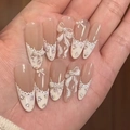 Short almond press-on nails featuring white lace French tips and 3D ribbon bows - French Bow Floral Style (JL0671)