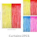 Two-pack colorful party foil fringe curtains in red, yellow, blue, and pink combinations - Foil Fringe Curtains