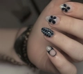 Macro detail of almond press-on nails featuring black floral and grey snake skin patterns - Black Floral Snake Print Almond Style (CW790)