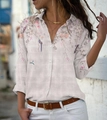Detailed view of floral and bird print on a long-sleeved lapel button-up shirt - S / Tops / Long Sleeve / Pink
