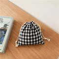 Minimalist black and white checkered cotton linen drawstring storage bag on wooden desk - 14x16cm / Black Plaid Small Size
