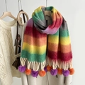 Detail of rainbow striped mohair scarf with purple and orange pom poms and tassels - Rainbow