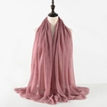 Detail showing the pleated texture and soft frayed edges of the dusty pink linen scarf - Pink Purple