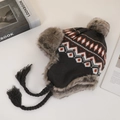 Close-up of knit trapper hat with orange geometric pattern and gray faux fur lining - M (56-58cm) / Coffee Rhombus