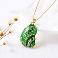 Elegant 18k gold plated conch shell pendant necklace with green enamel on white background - Green Conch