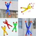 Spider-shaped sticky wall crawler toys in red, yellow, blue, and green set of 4 - Sticky Wall Climber