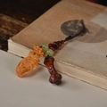 Retro wooden persimmon and peanut keychain pendant displayed on an old book - Life Goes Well Pendant