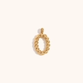 Macro detail of gold 18K plated twisted rope letter O pendant with metallic luster - Letter O