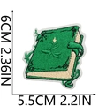 Detailed view of green magic book embroidery patch with dimensions showing 6cm x 5.5cm - Spell Book