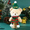 Close-up of beige plush teddy bear wearing green knitted hat and red-green scarf - 15-18cm / Teddy Fleece Bear + Green Hat Red Green Scarf