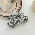 Elegant bow hair claw with black and white abstract pattern in premium acetate material - Linen Grey