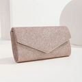 Close-up of pink glitter evening clutch bag with V-shaped flap on minimalist white stand - Champagne