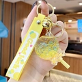 Cute yellow lollipop keychain with luminous sand, golden bell and Good Luck silicone strap - Noctilucent Bubble Bead Lollipop-Yellow