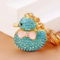 Detail of blue rhinestone encrusted duck keychain with pink bow and gold metal ring - Blue Full Rhinestone Duck