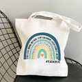 Rainbow Teacher canvas tote bag with motivational quotes on a black metal chair - STD374-Q Multi-keyword Rainbow/#TEACHERLIFE