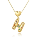 Detailed shot of a gold heart pendant with a multi-colored zircon-inlaid letter H - Letter H