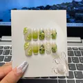 Uñas postizas hechas a mano verde lima con rodajas de cítricos 3D y pedrería fina - M