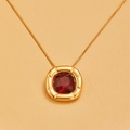 Macro shot of 18K gold plated square necklace with red zircon stone and radial engraving - Pendant Necklace / Gold - Red Zircon