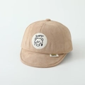 Detail view of khaki baby baseball cap featuring Lucky bear patch and soft velvet texture - Bear / Khaki