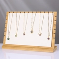 Bamboo necklace display stand featuring assorted gold pendant designs with colored zircon - ZM009 Large White PU Leather