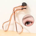 Macro view of rose gold eyelash curler with high-elastic black rubber pad for lash curling - Sectional Rose Gold