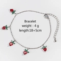 Close-up of strawberry pendant bracelet with red cubic zirconia on silver chain - Silver Strawberry Motif Bracelet
