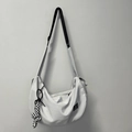 Light gray crescent nylon hobo bag with adjustable black strap and checkerboard rabbit charm - Gray + Twist Knot